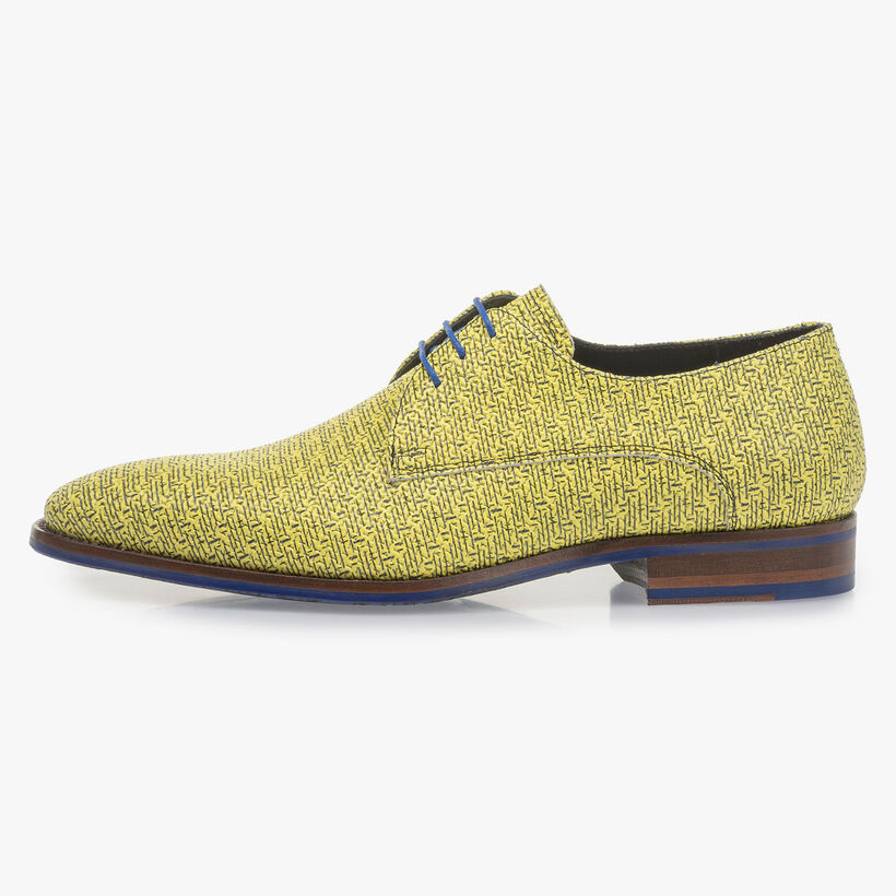 Yellow leather lace shoe with black print