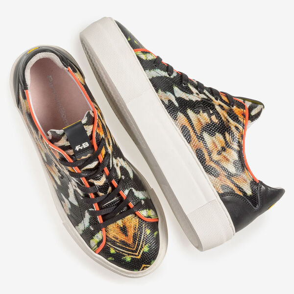 Black leather sneaker with orange-coloured print