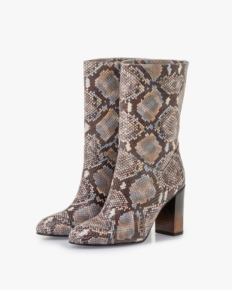 Brown and white leather boots with snake print