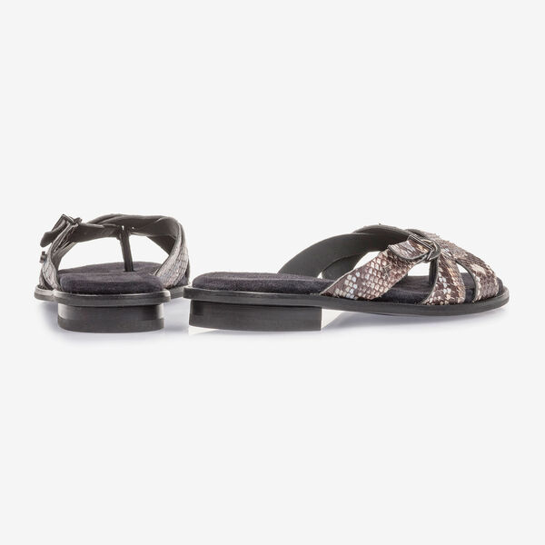 Brown and white leather slipper with snake print
