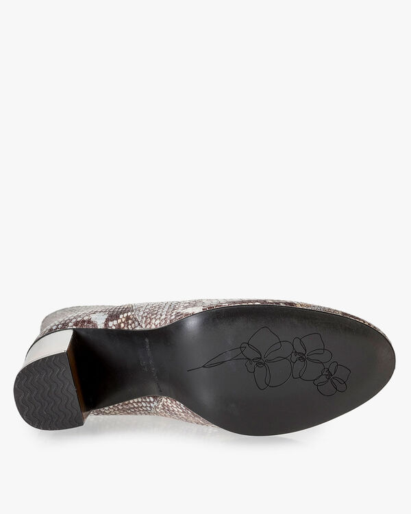 Brown and white leather boots with snake print