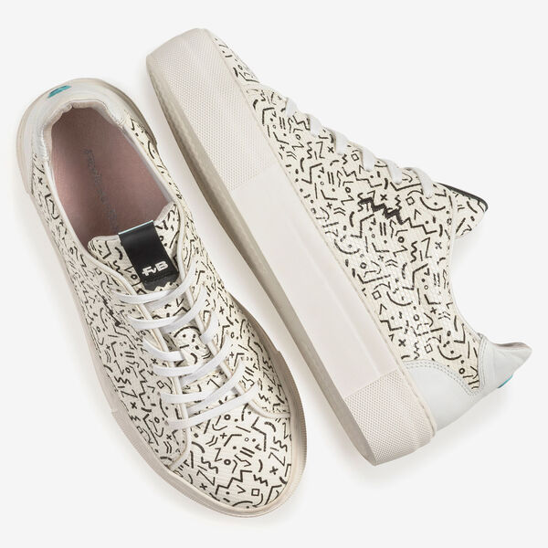 White leather sneaker with black print