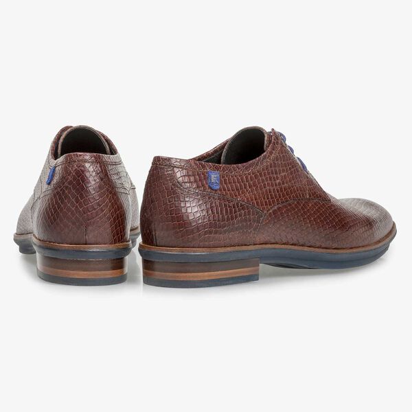 Cognac-coloured leather lace shoe with snake print
