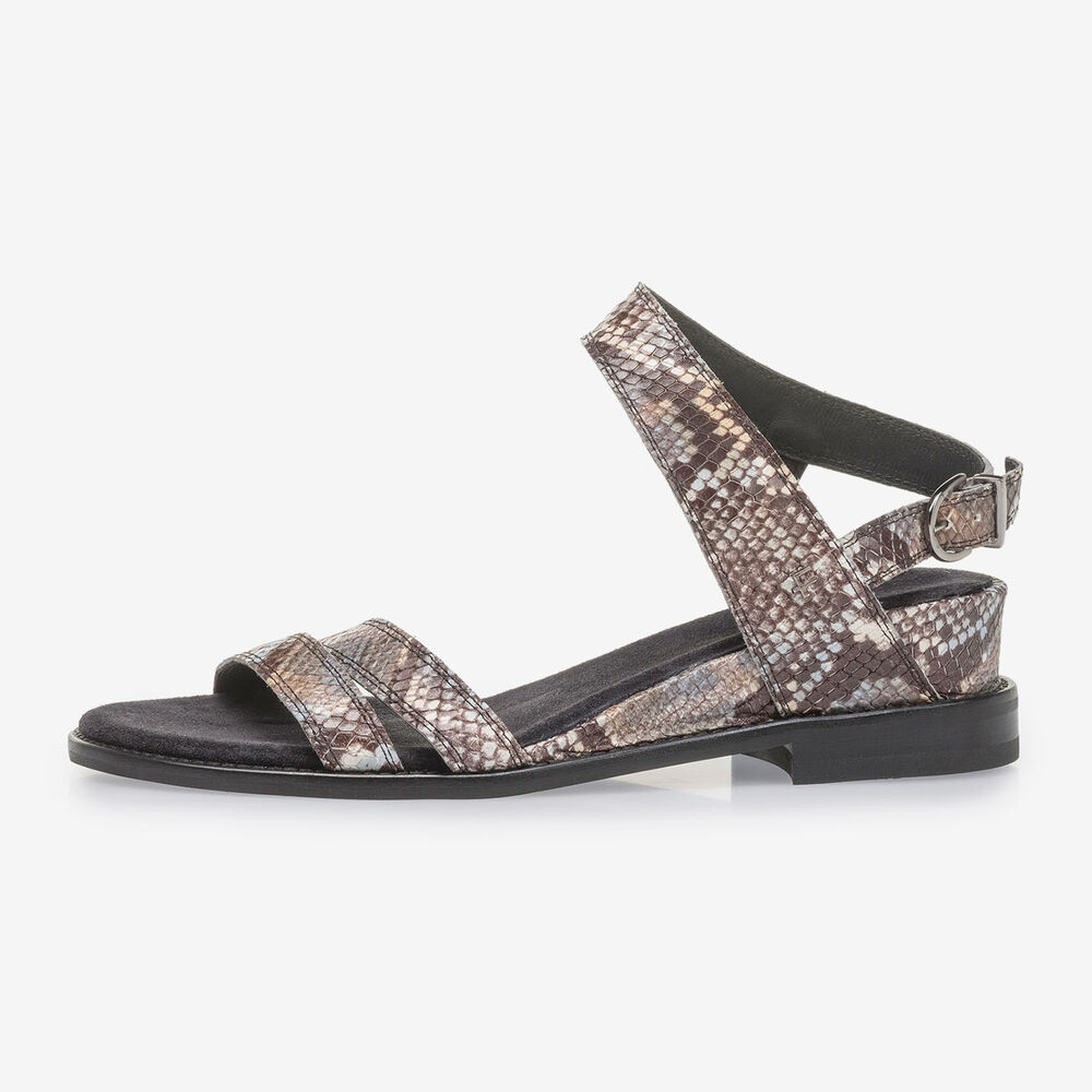 Brown and white leather sandals with snake print