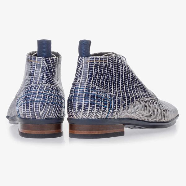 Blue leather lace boot finished with a lizard print