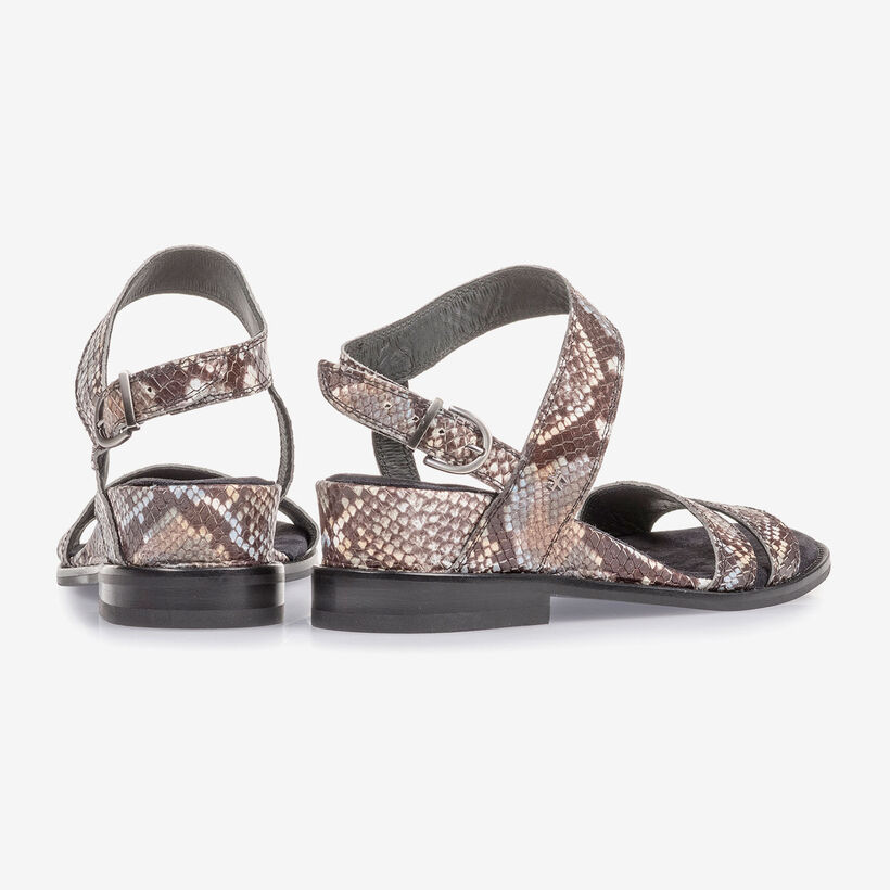 Brown and white leather sandals with snake print